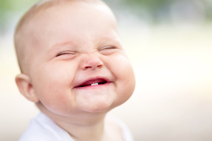 A toddler with a few teeth