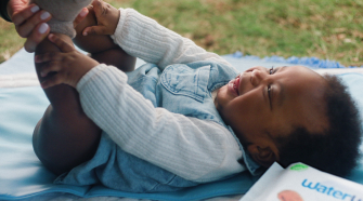 newborn baby lying on the ground