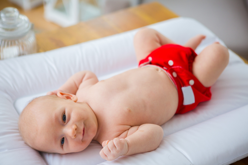 A baby wearing a pocket nappy.