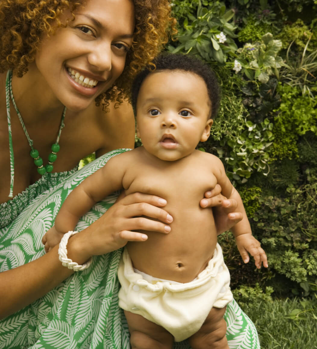 A baby wearing a shaped nappy.