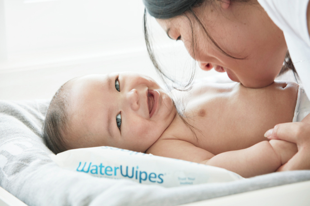 a mother with her baby after having had a baby bath