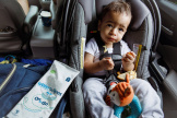 WaterWipes On the Go pack beside a toddler who is having snacks