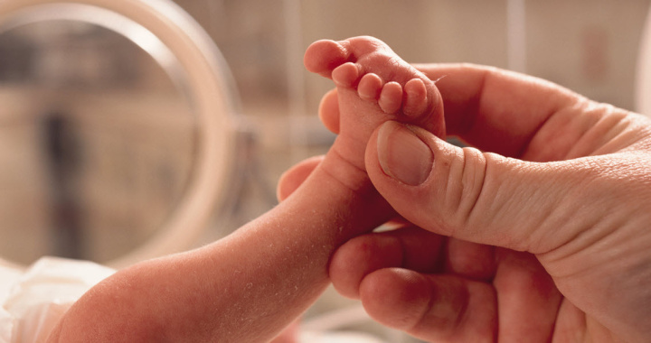 A premature baby in an incubator