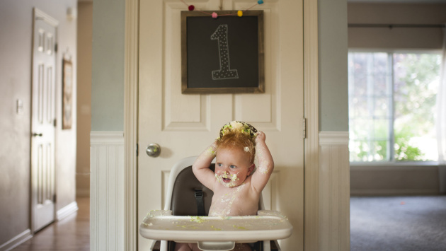 baby covered with a cake