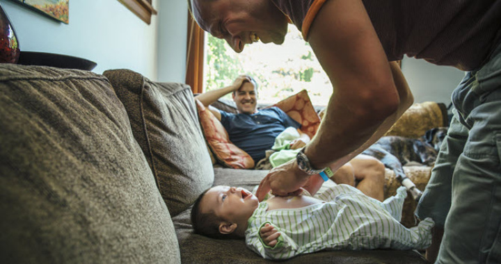 dad changing his newborn baby's nappies