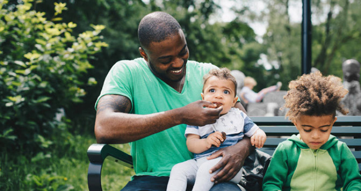 dad wiping his baby's face