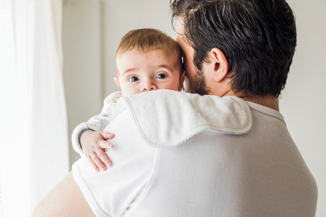 dad is holding a baby