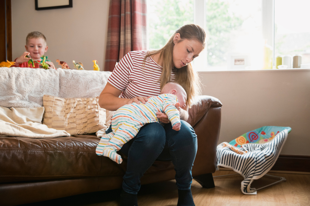 How to burp a baby lying on your lap.