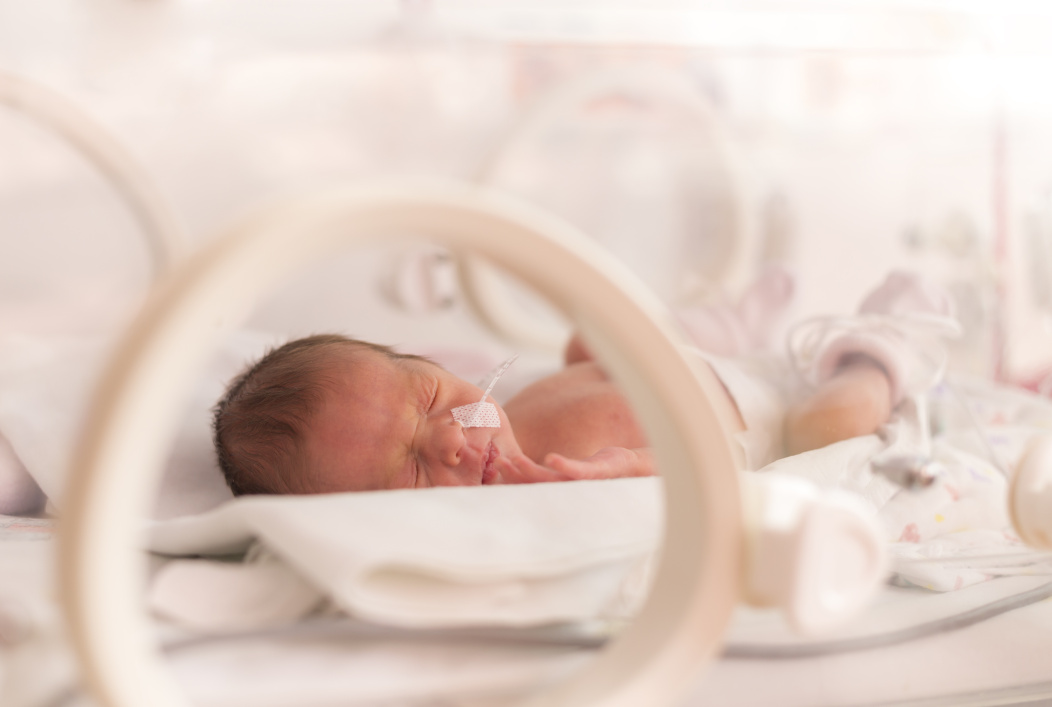 premature baby in incubator in NICU